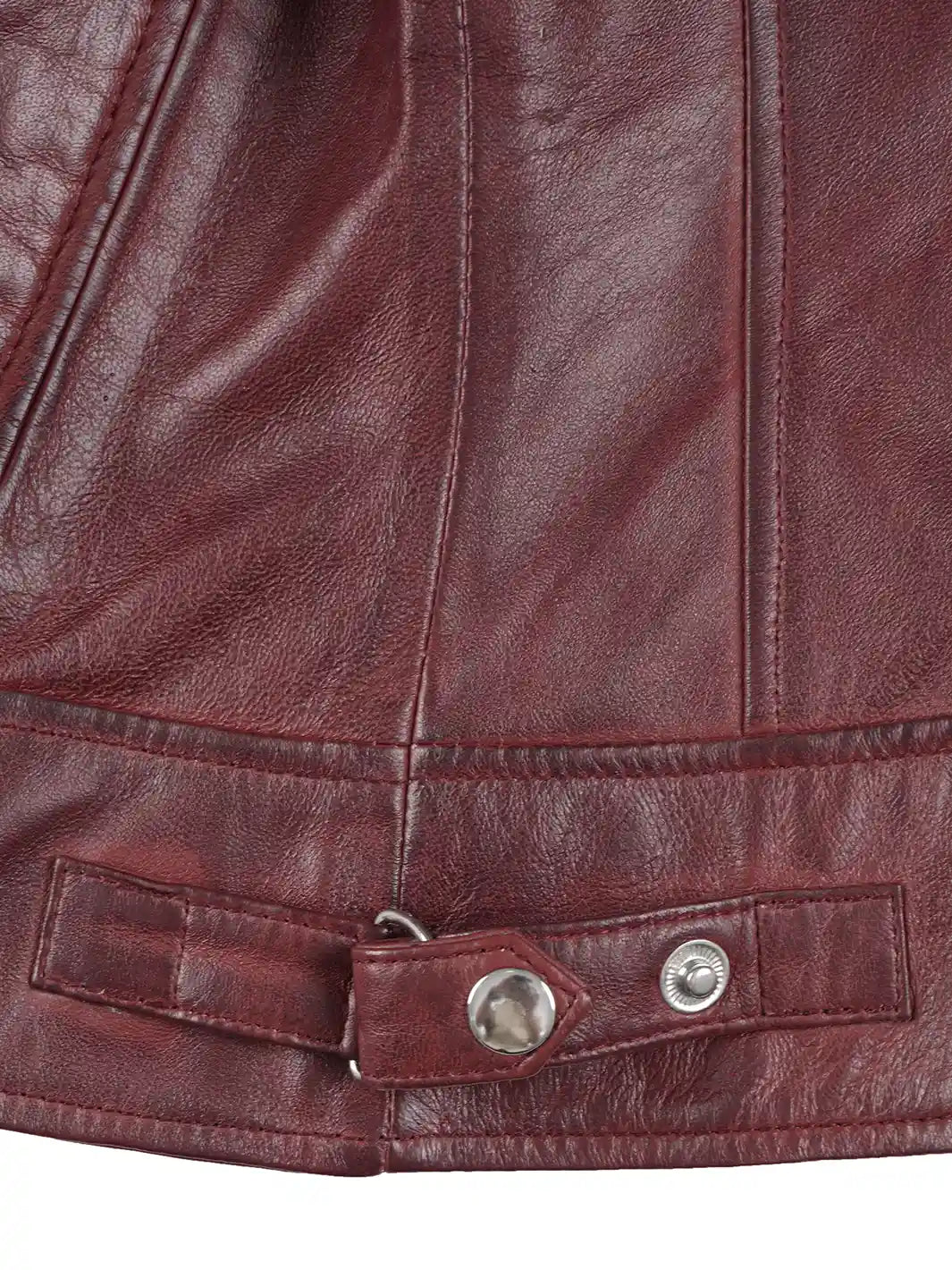Close-up of a maroon leather jacket with a button detail
